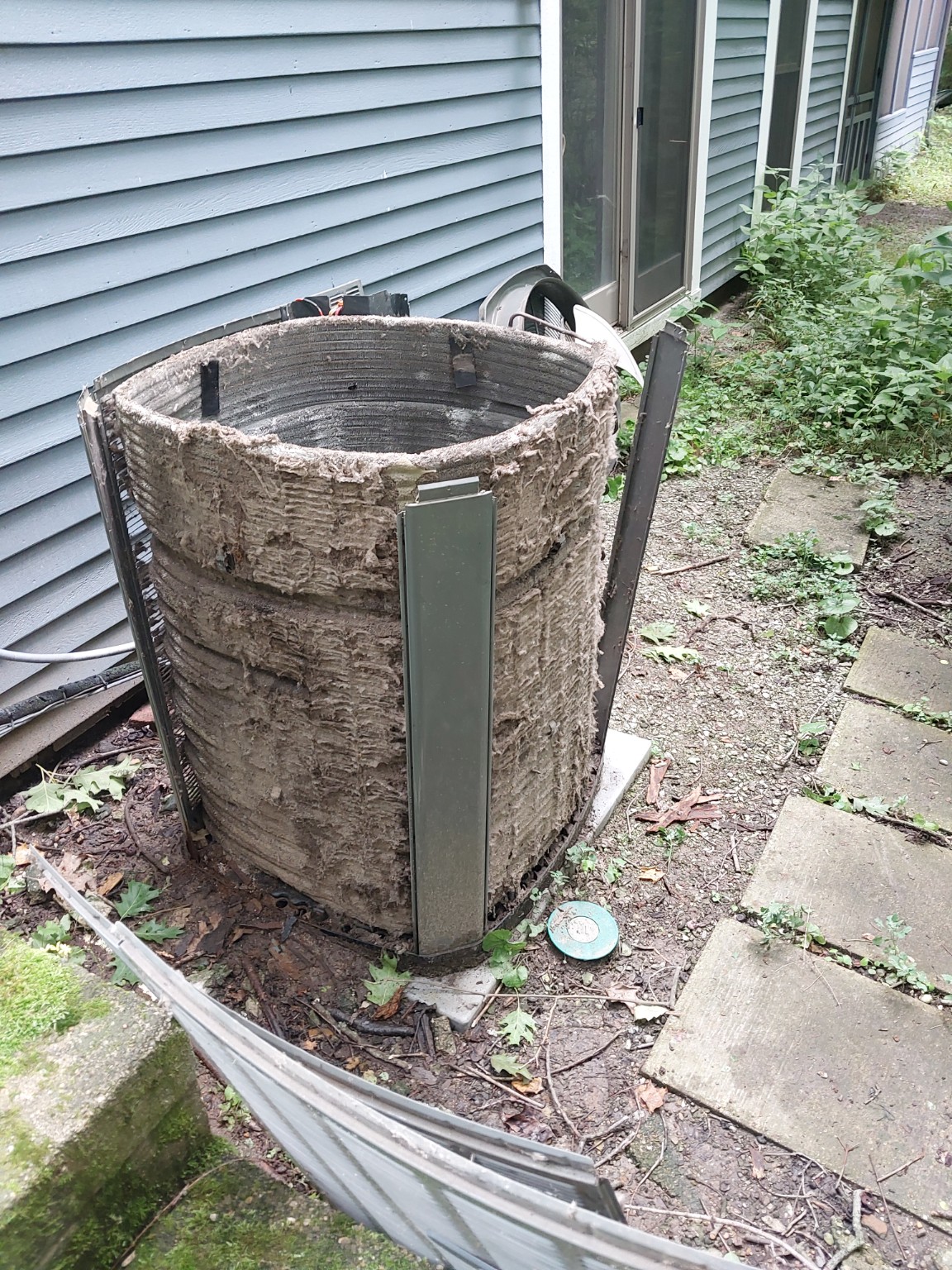 Condenser coil buildup. An example of substantial buildup on an outdoor coil, showing why equipment inspections matter.